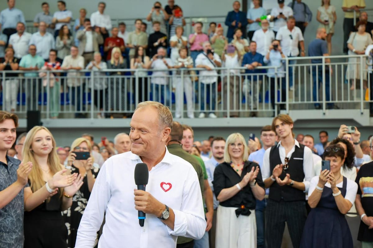 Polish Prime Minister Donald Tusk talks to supporters