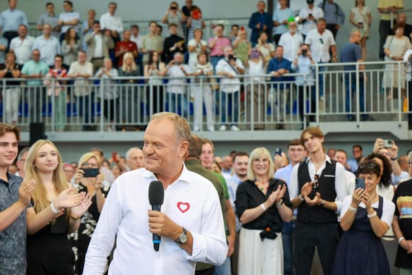 Polish Prime Minister Donald Tusk talks to supporters