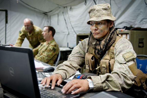 Soldiers with the laptop at a New Zealand millitary operation 