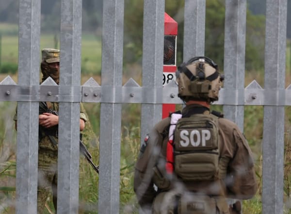 Soldiers face off across the Polish‑Belarusian frontier